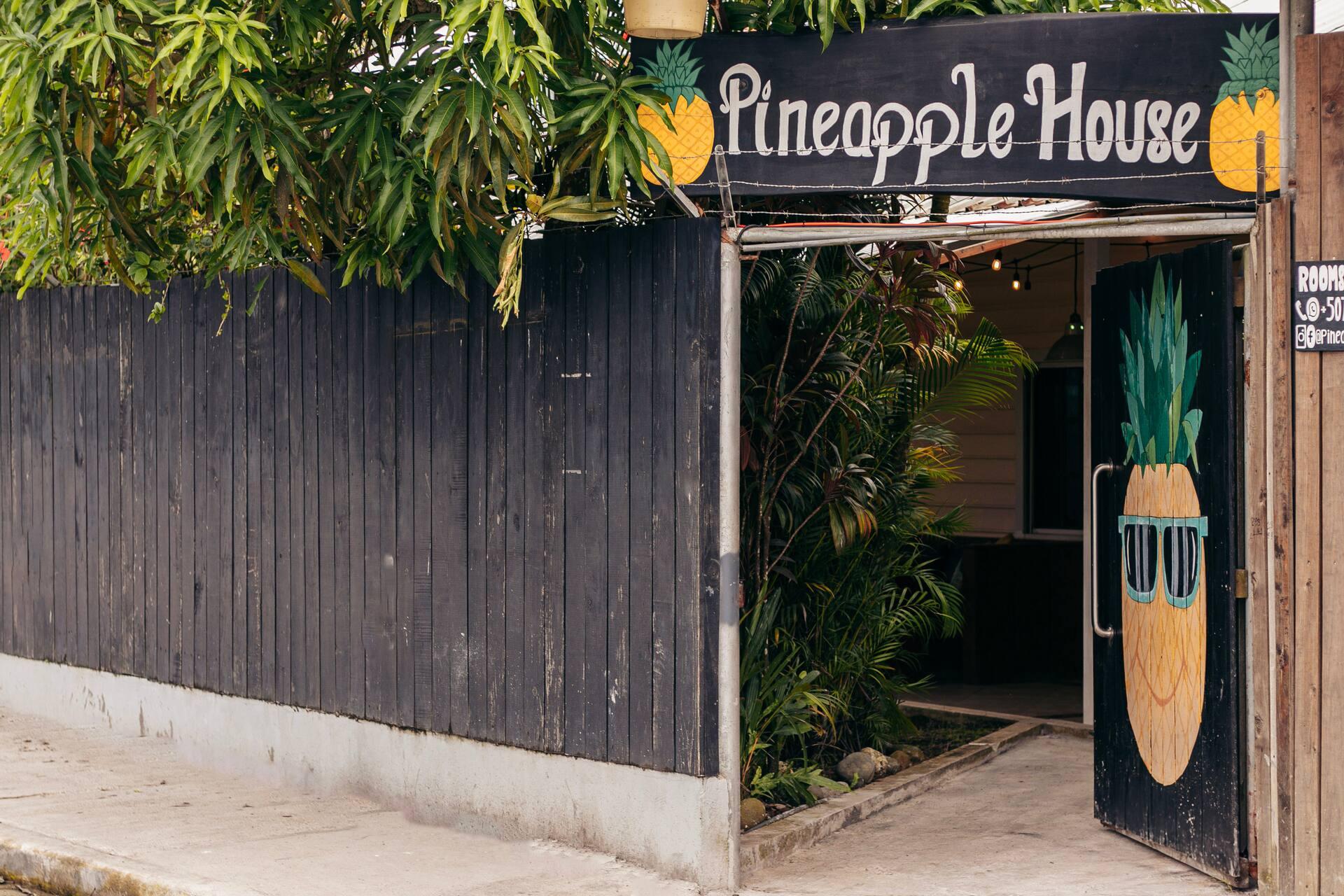 The hand painted Pineapple House sign at the entrance